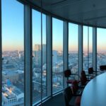 Modern office with city skyline view, symbolizing business immigration, investor visas, and corporate opportunities in the U.S.