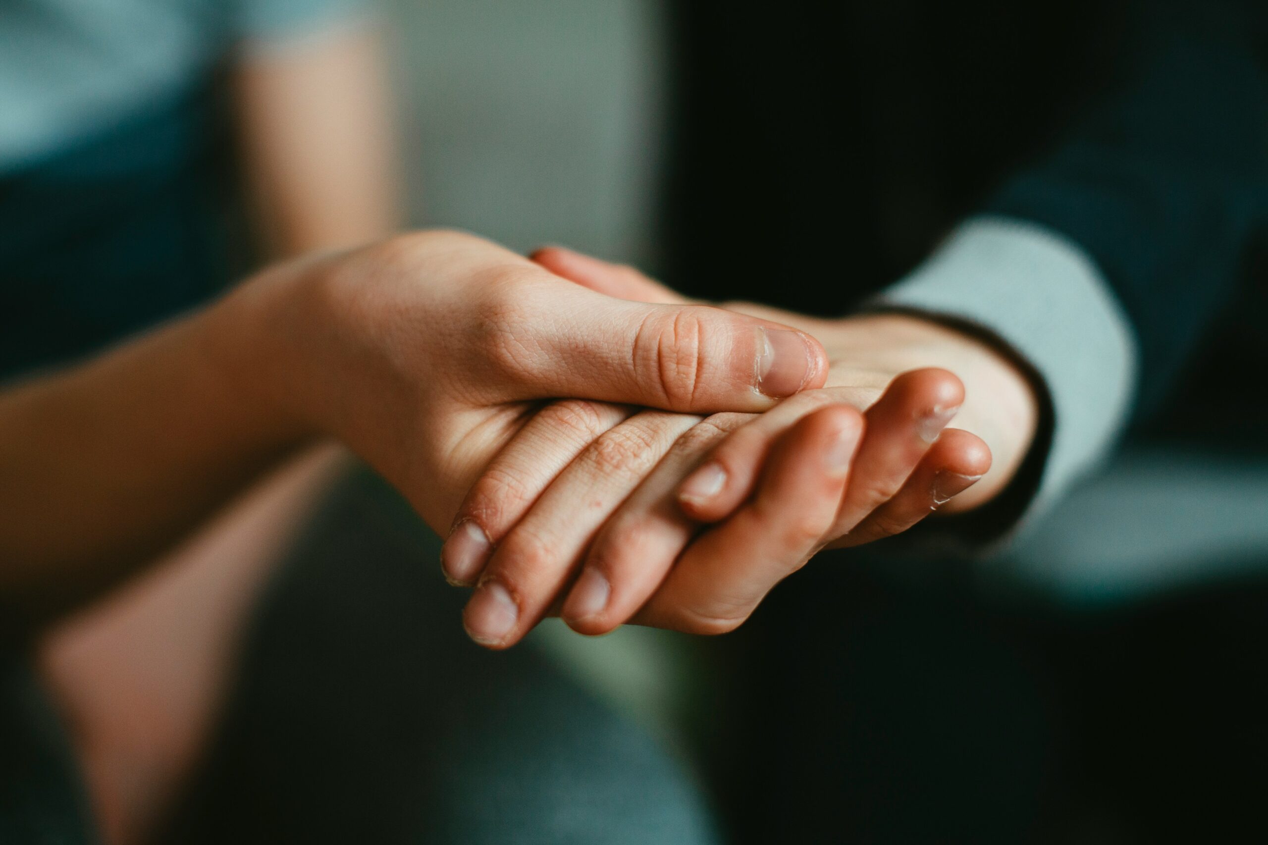 Humanitarian Compassionate Applications - Edwards Law An image showing the holding hands of spouses, to represent the Canadian spousal sponsorship opportunities.