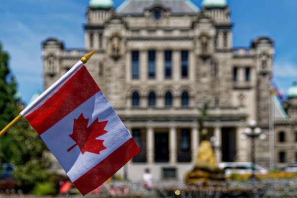 1 - Edwards Law A Canadian flag in front of a government building