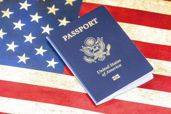 15 - Edwards Law An image showing an American passport laying atop an American flag to represent the U.S. Naturalization process.
