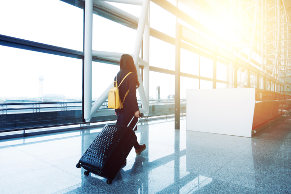 2 - Edwards Law An image showing a person in an airport travelling with a B-1 Temporary Business Visitor Visa.