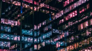 Executive Capacity - Edwards Law A photo of windows outside an office building where executives who utilized the L-1A visa work.